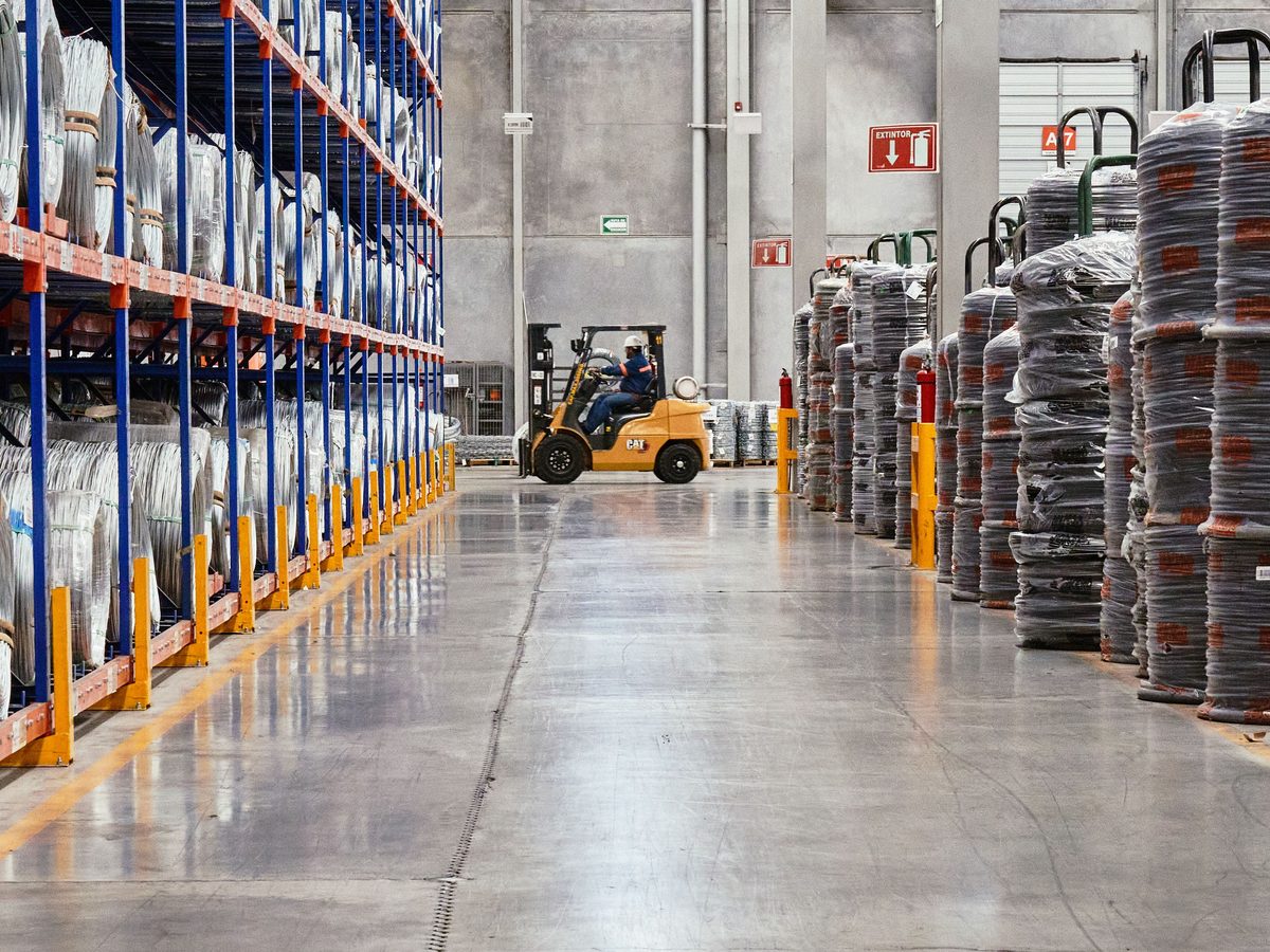 Pallet racking and a forklift in a distribution centre aisle